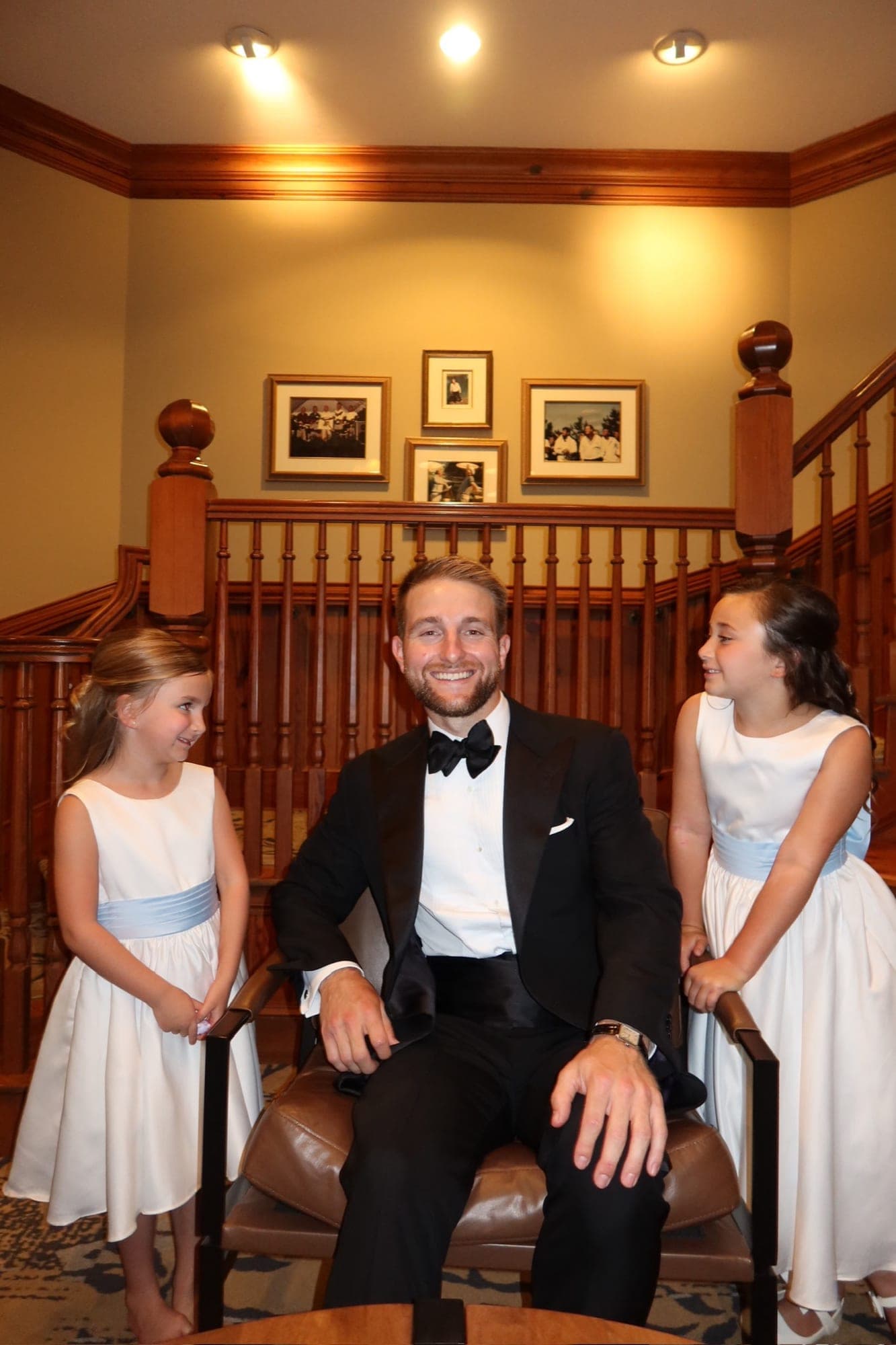 the groom with the flower girls
