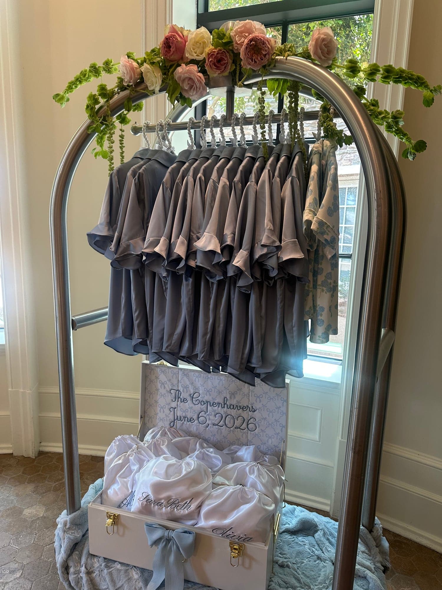 the rail of robes and gowns, ready for the morning