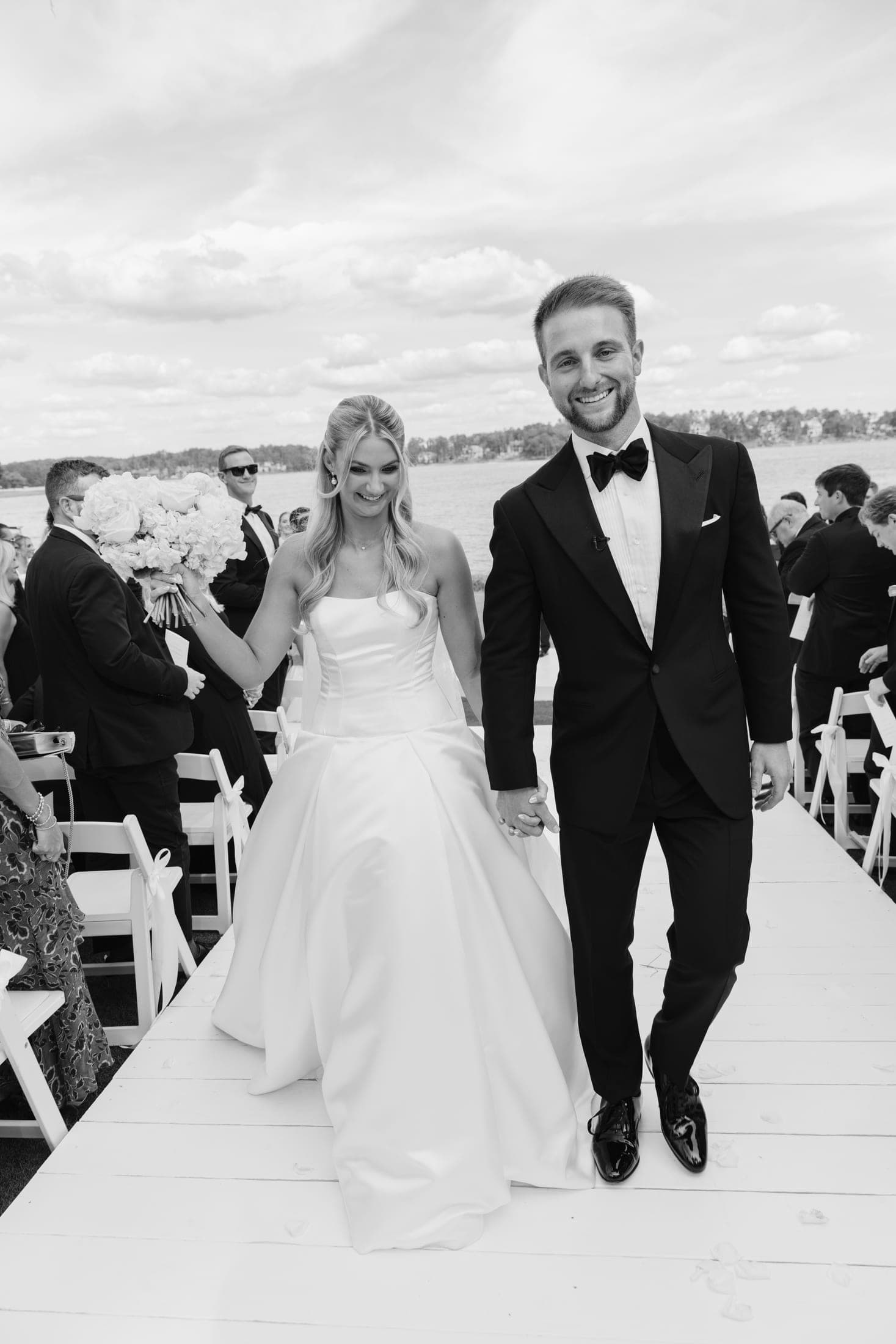 walking back up the aisle just married, in black and white