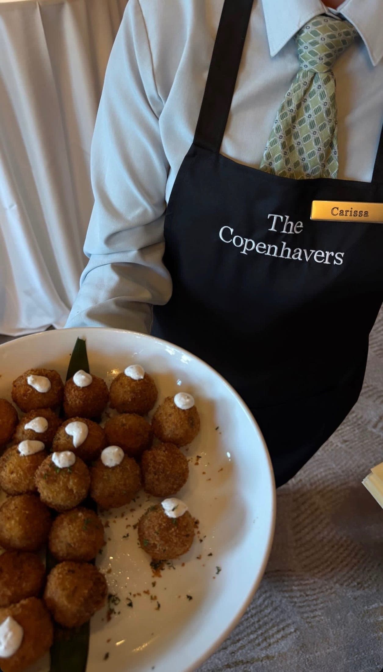 the kitchen apron, embroidered with the new family name